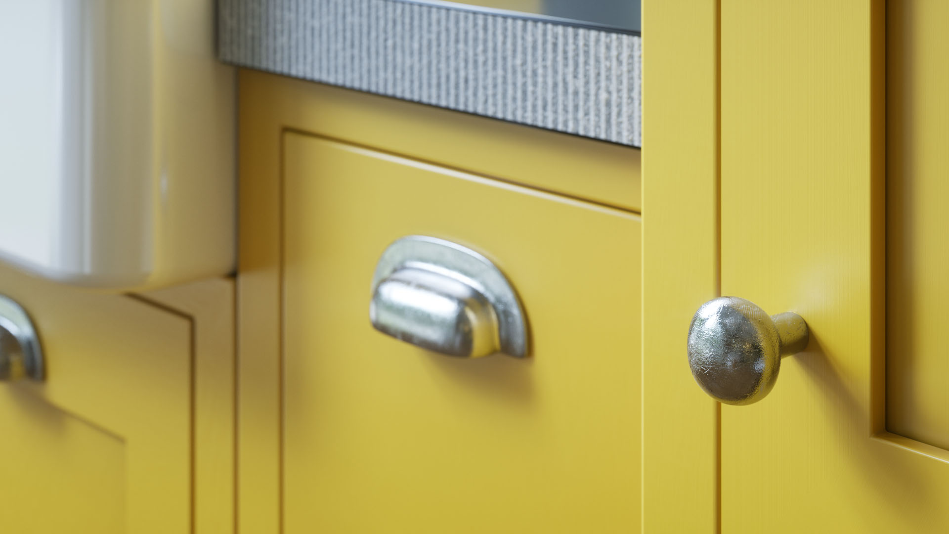 Schubladengriff an gelber Küchenfront, CGI-Detail